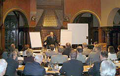 Franz Ehrhardt speaking to a group on business strategy formulation.